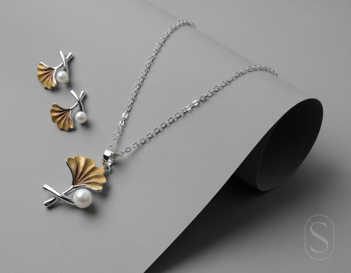 Jewelry set with necklace and earrings on a maroon background by silverlab